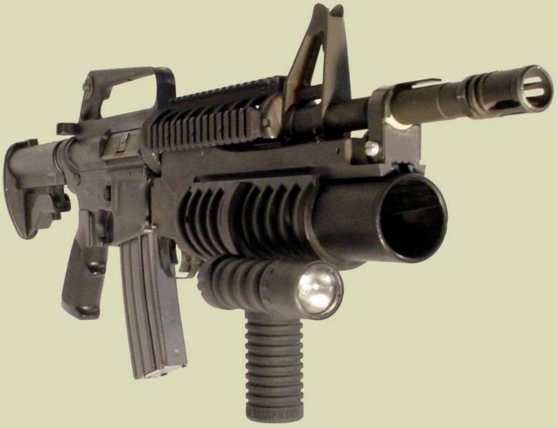 Shown is the M4 rifle with the M203 40mm grenade launcher and the M203grip with the Tactical Light accessory.  The flashlight accessory can also be added to create an M4 foregrip with flashlight or an M16 rifle flashlight.