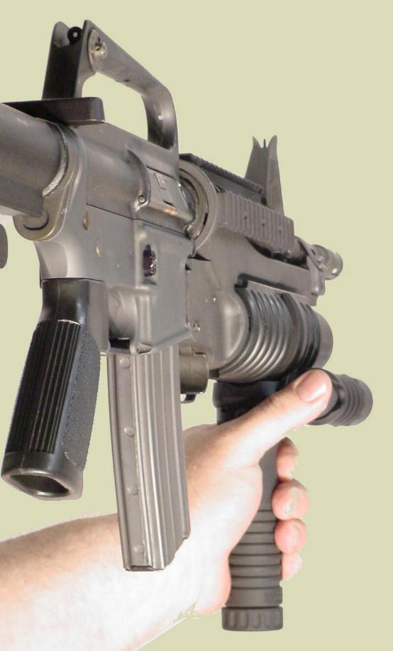 Picture of the M4 rifle with the M203 40mm grenade launcher and the M203grip with the Tactical Light accessory.