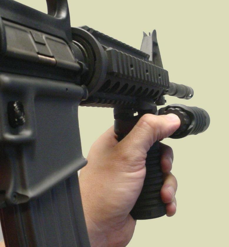 Picture of the M4 rifle with the RM Rail Grip with the Tactical Light accessory.