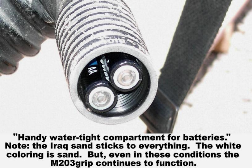 Photograph demonstrating benefits of using the M203grip on the M203 40mm grenade launcher.  The "handy water-tight compartment for batteries" has been proven waterproof at 20 meters (66 feet) for 2 hours by U.S. Navy approved, independent testing lab.  The O-Ring seal provides advanced performance in extreme conditions from -35 to 200 degrees Centigrade (-31 to 392 degrees Fahrenheit.  Even in the sandy conditions in Iraq, the M203grip continued to function flawlessly after 6 months. M203grip is manufactured by RM Equipment.