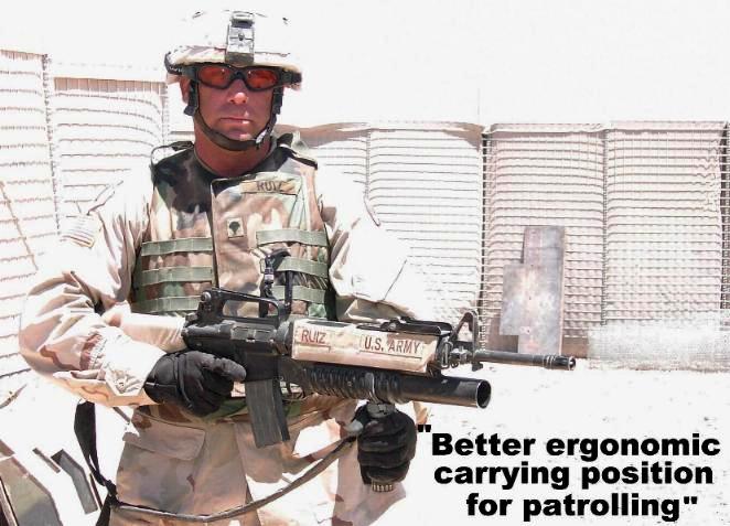 Photo showing how the M20grip provides a better ergonomic carrying position when the M203grip is used with the M203 grenade launcher.