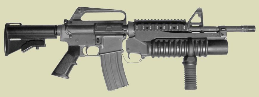 M203 40mm greande launcher on the M4 carbine with the M203grip attached.